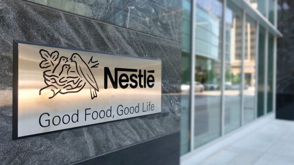 A sign showing the Nestlé corporate logo