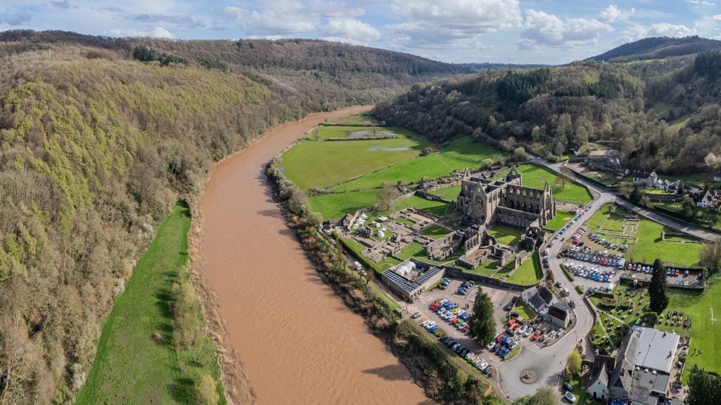 An aerial shot of Tintern Abbey and the River Wye, Monmouthshire, United Kingdom